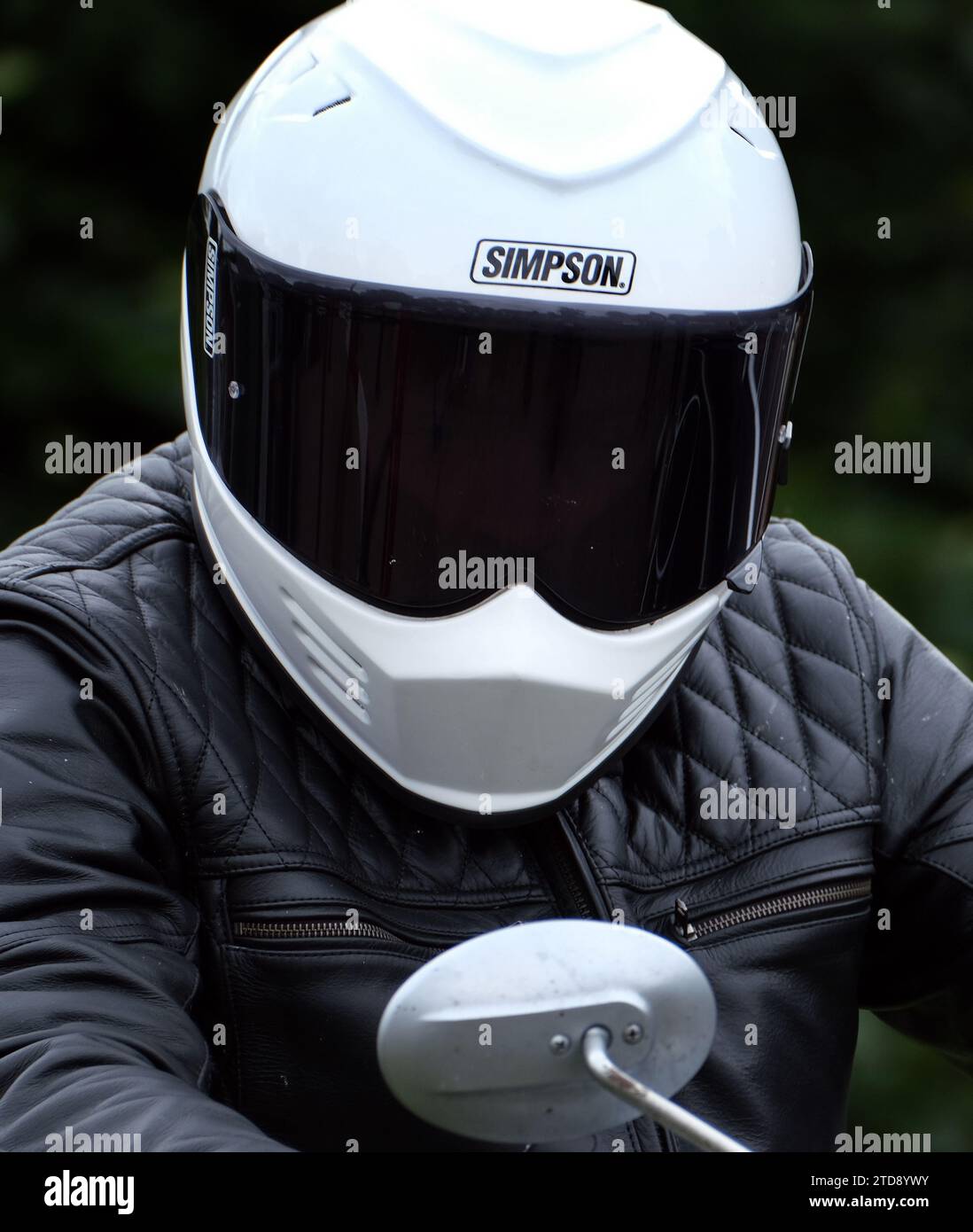 Modern bikers safety helmets at outdoor bike club show. Stock Photo