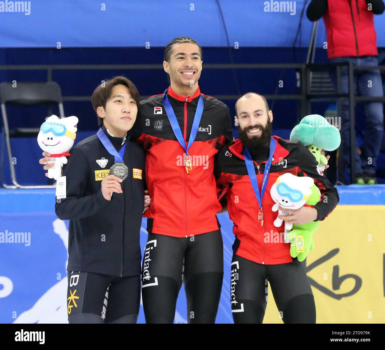 Seoul, South Korea. 17th Dec, 2023. Gold medalist William Dandjinou (C) of Canada, silver medalist Park Ji Won (L) of South Korea and bronze medalist Steven Dubois of Canada pose the awarding ceremony for the men's 1500m (2) final A at the ISU World Cup Short Track Speed Skating series in Seoul, South Korea, on Dec. 17, 2023. Credit: Yao Qilin/Xinhua/Alamy Live News Stock Photo