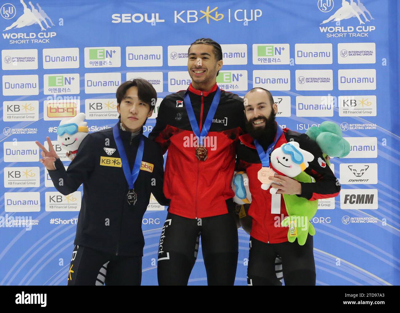 Seoul, South Korea. 17th Dec, 2023. Gold medalist William Dandjinou (C) of Canada, silver medalist Park Ji Won (L) of South Korea and bronze medalist Steven Dubois of Canada pose during the awarding ceremony for the men's 1500m (2) final A at the ISU World Cup Short Track Speed Skating series in Seoul, South Korea, on Dec. 17, 2023. Credit: Yao Qilin/Xinhua/Alamy Live News Stock Photo