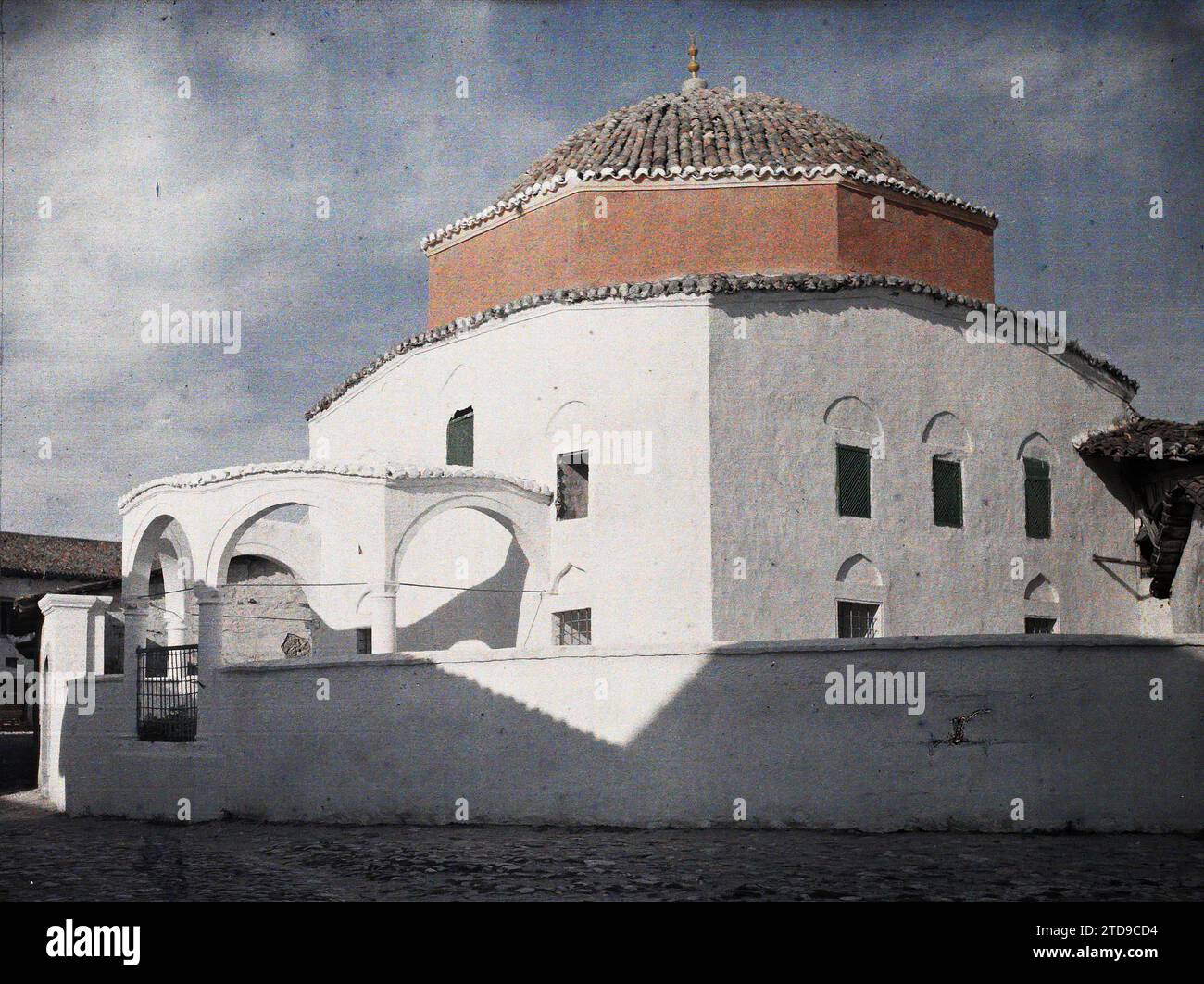 Durrës, Albania A mosque with whitewashed walls and a demolished