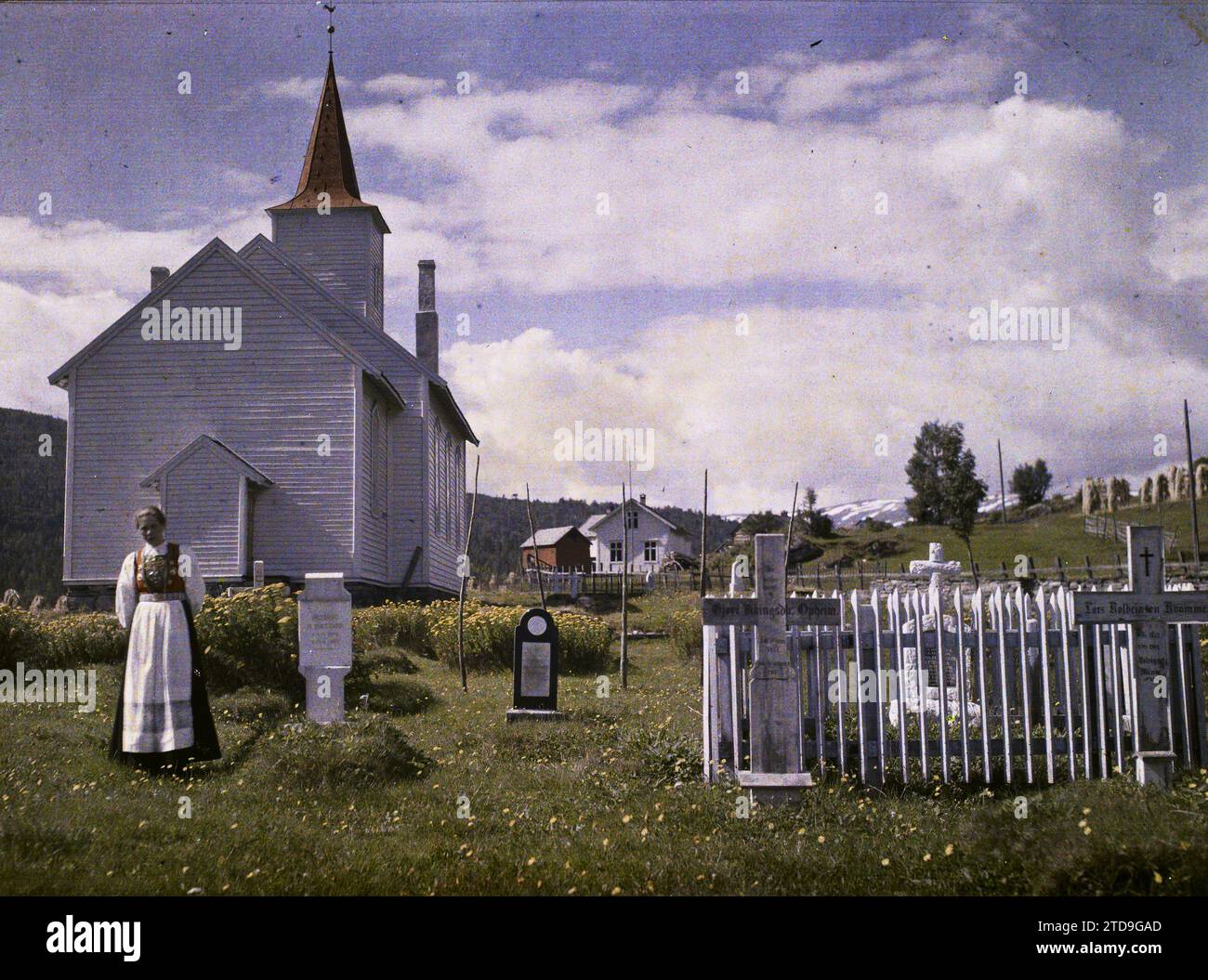 Opheim, Norway Woman posing in the cemetery in front of the church