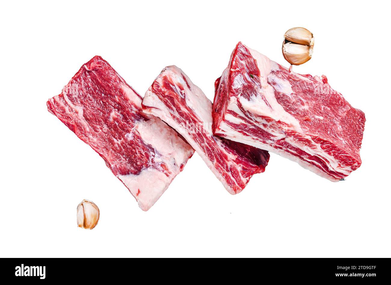 Beef calf short ribs meat in a grill pan ready for cooking Isolated on ...