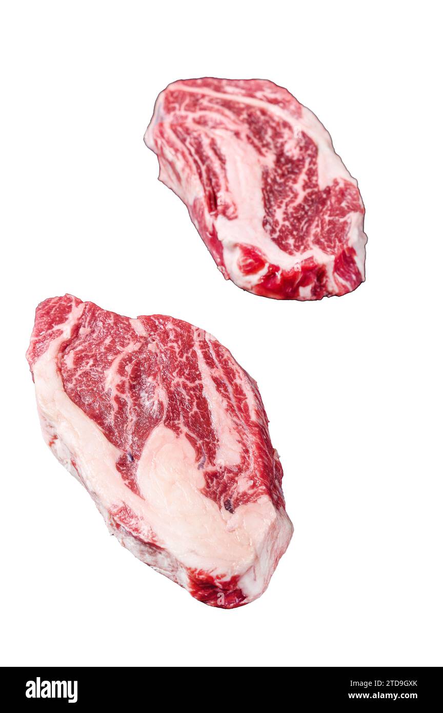 Raw chuck eye roll steaks, premium beef meat on a butcher board