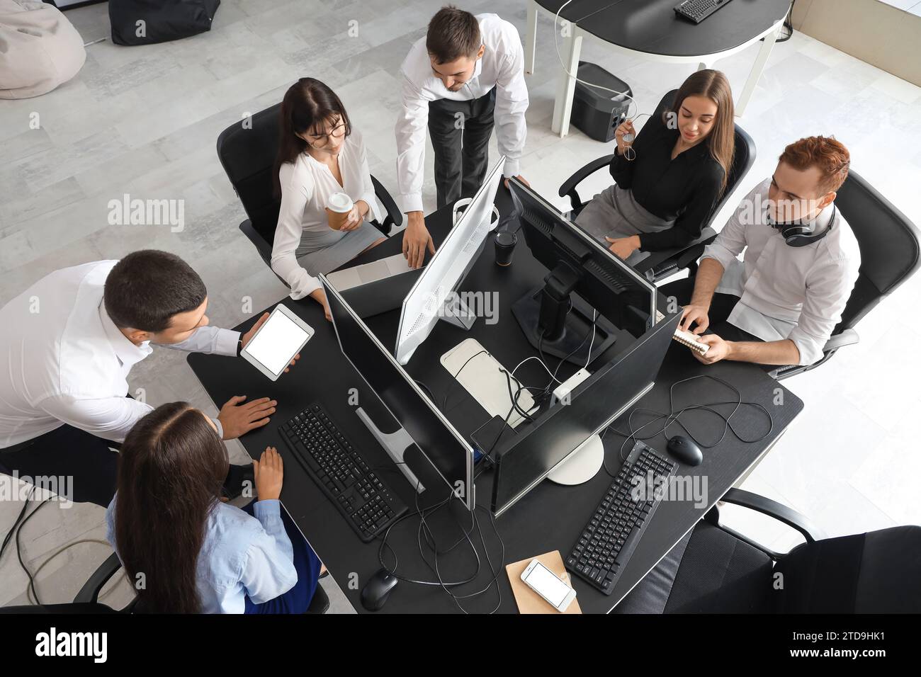 Team of young programmers working in office, top view Stock Photo