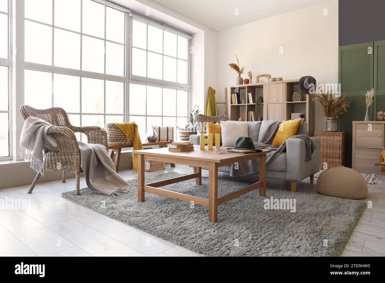 Interior of living room with grey sofa and table Stock Photo - Alamy