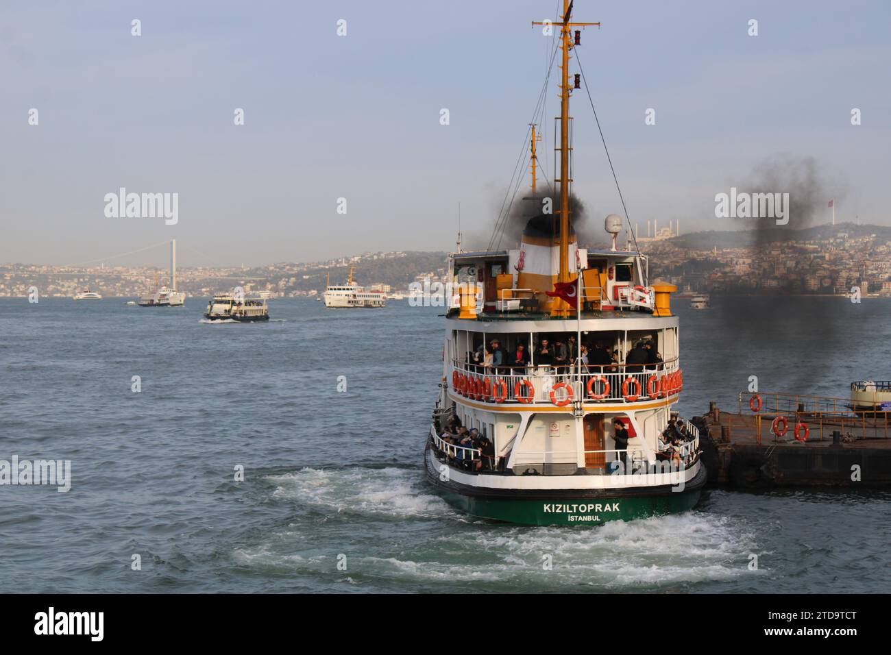 Passenger ferry belching black smoke on the Bosphorus river in Istanbul ...