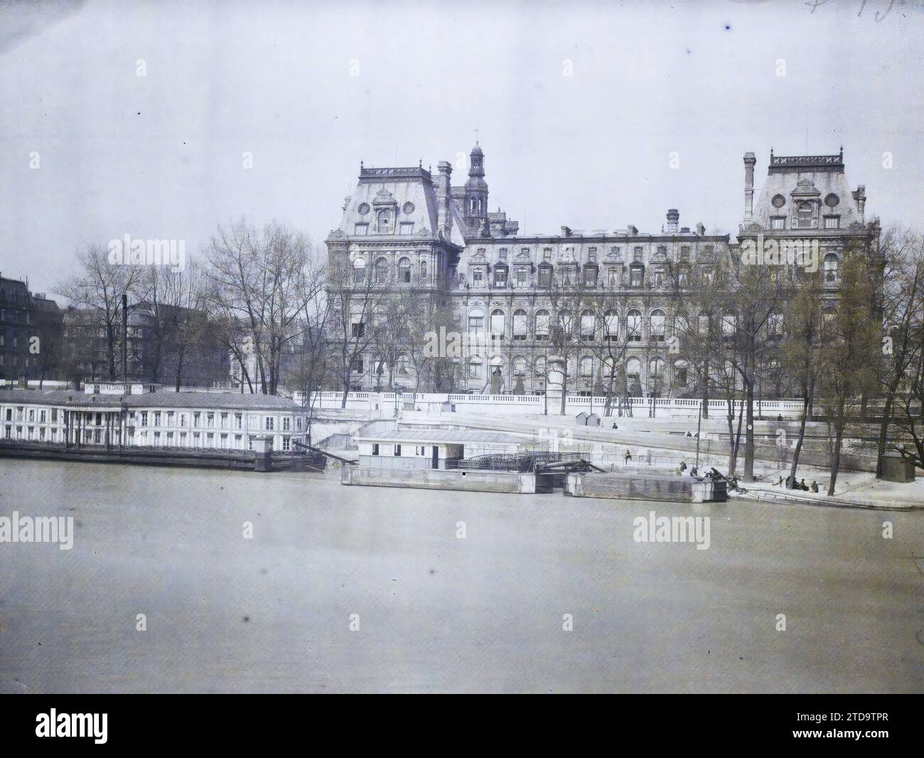 Paris (IVth arr.), France The Town Hall from the Quai aux Fleurs, Housing, Architecture, Transport, River, Town Hall, town hall, Public civil architecture, Quay, Boat, Baths/hammam, River transport, lake, France, Paris, View taken from the Quai aux Fleurs towards the Town Hall, Île de la Cité, Hôtel de Ville, 07/04/1924 - 07/04/1924, Léon, Auguste, photographer, Autochrome, photo, Glass, Autochrome, photo, Positive, Horizontal, Size 9 x 12 cm Stock Photo