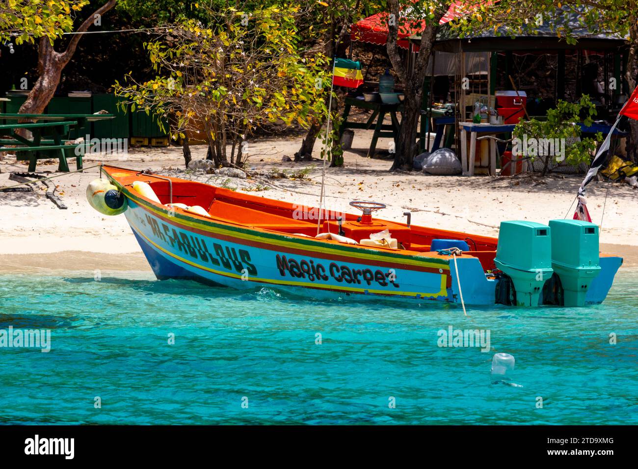 Mr Fabulous – Magic Carpet Water Taxi, Island Beach of Petit Rameau, With Picnic Tables, Tobago Cays Marine Park, The Grenadines, Eastern Caribbean. Stock Photo