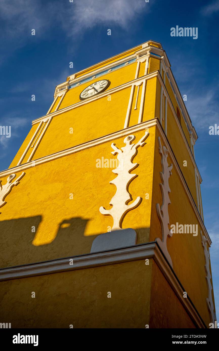 Perspective from below of the Bullas Clock Tower, Region of Murcia, with its characteristic intense yellow color Stock Photo