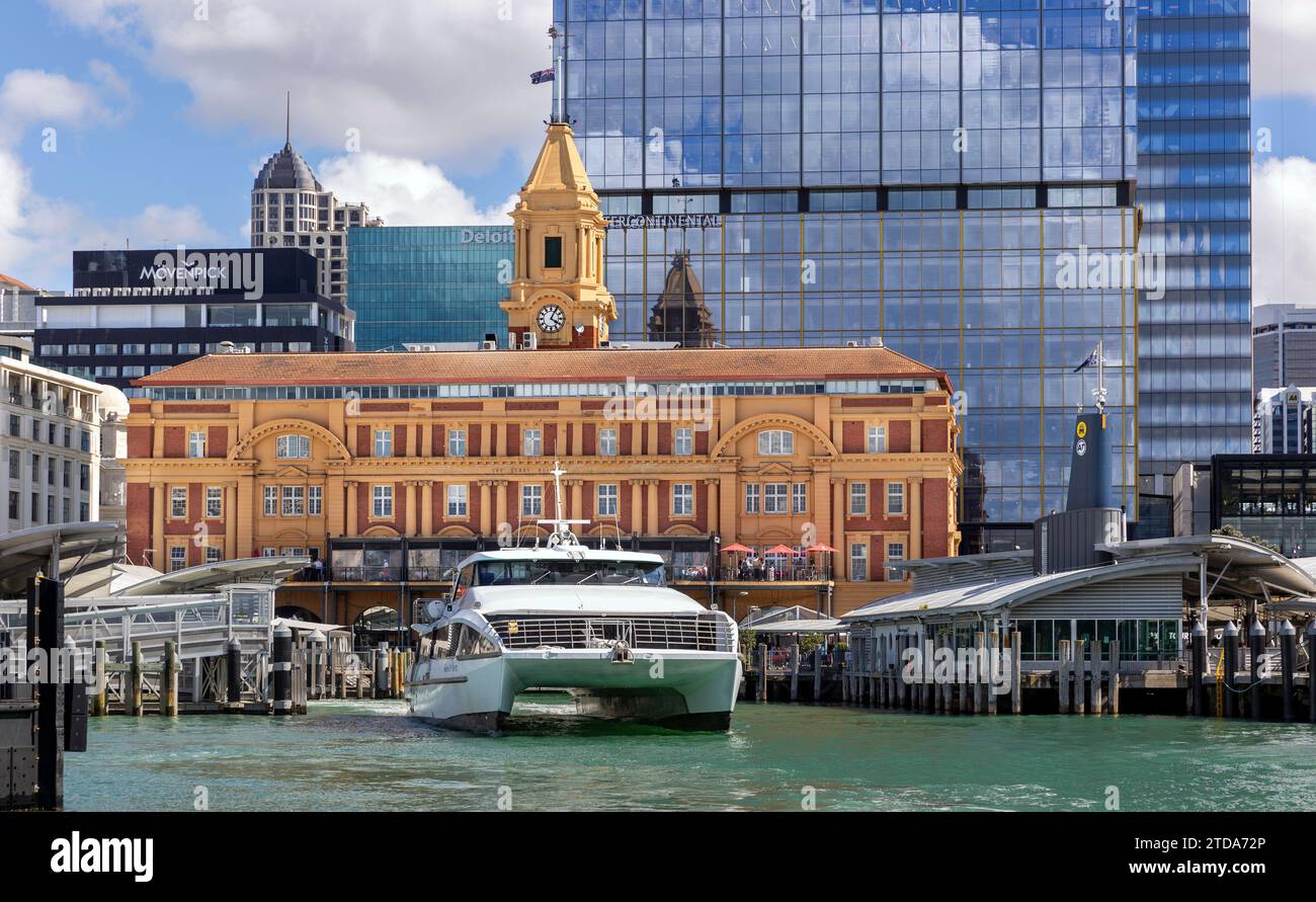 Water transport and the 1912 Ferry Building in downtown Auckland, New Zealand Central Business District.  The building was designed by Alex Wiseman an Stock Photo