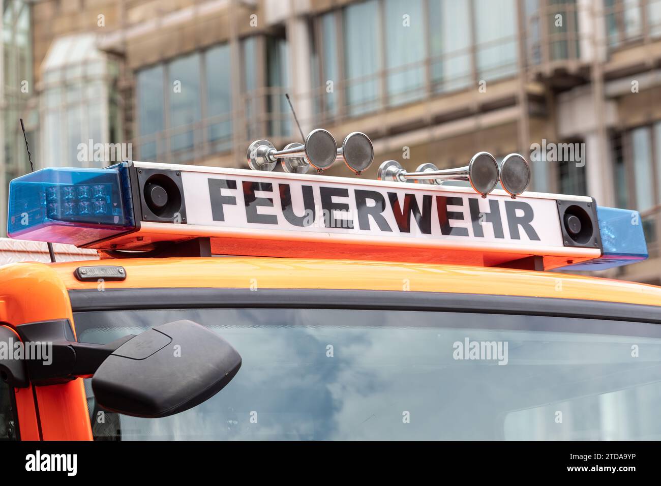 German Fire Truck with Feuerwehr Sign and Emergency Lights: First Responder and Public Safety Equipment Stock Photo