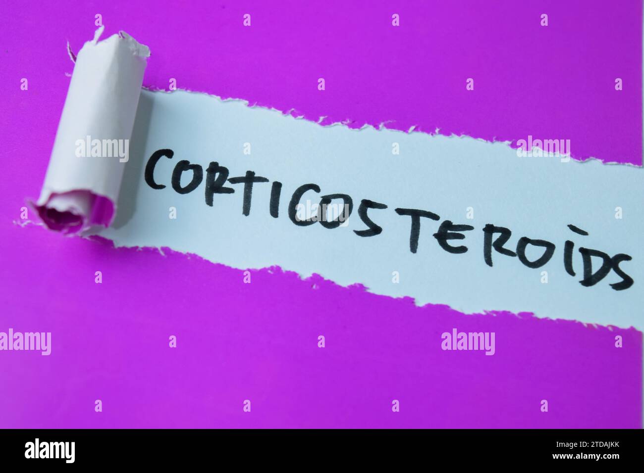 Concept Corticosteroids text written in torn paper. Medical concept