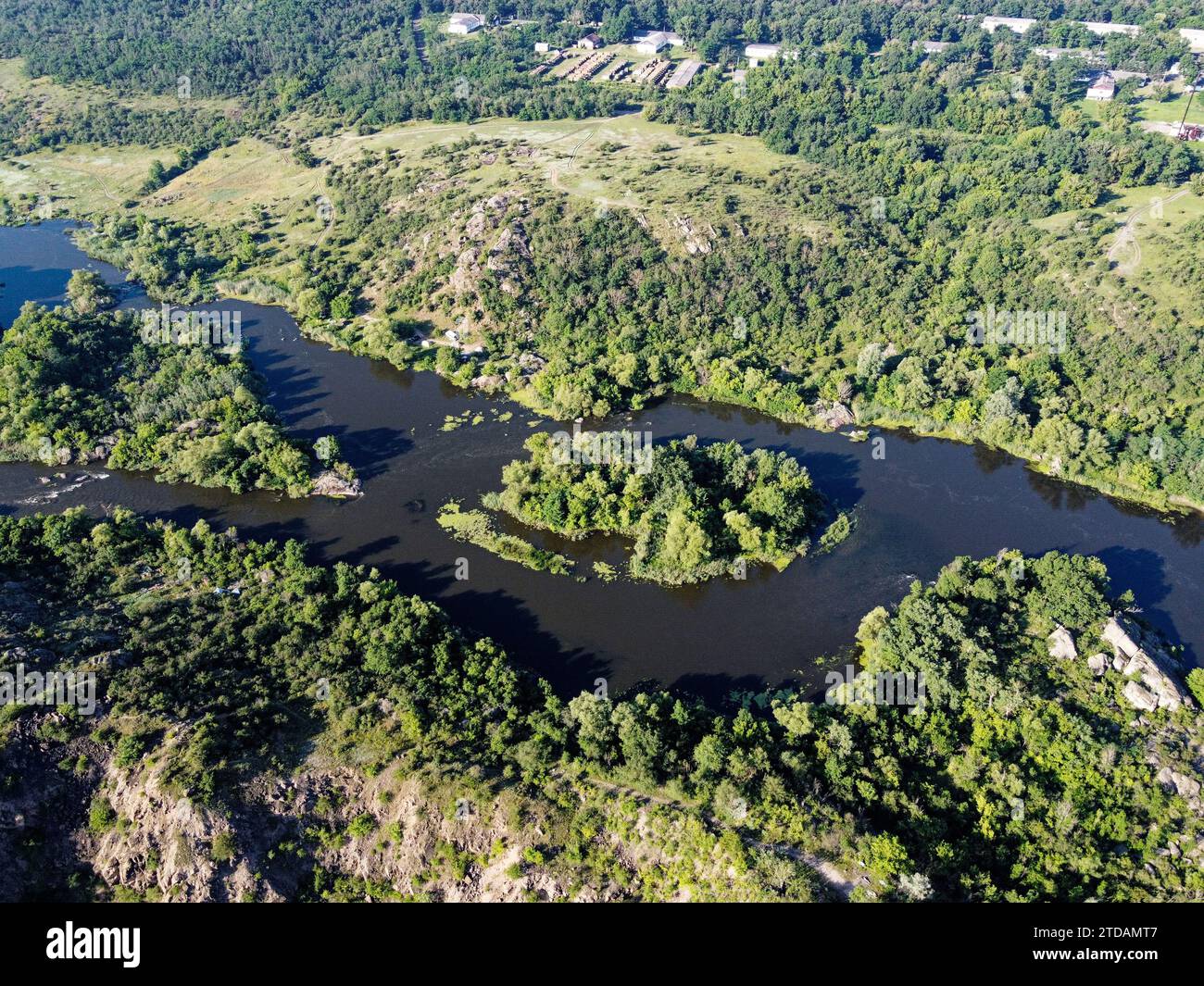 Winding bed of the Southern Bug river. River, landscape from a bird's eye view. Rough, rocky terrain. Stock Photo