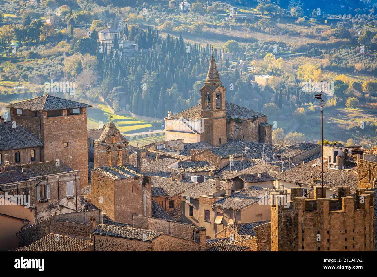 View of old town of Orvieto in Italy from above rooftops at sunset Stock Photo