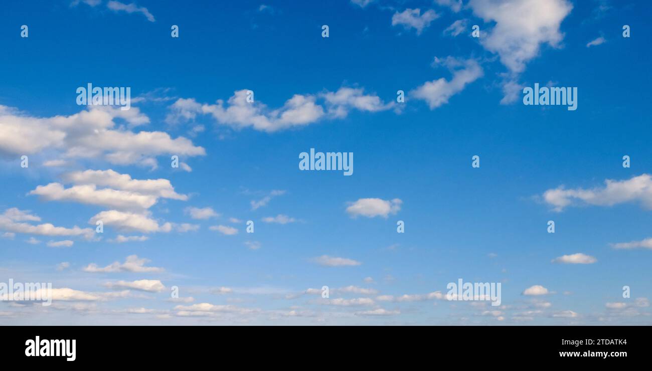 A beautiful blue sky with fluffy white clouds Stock Photo - Alamy