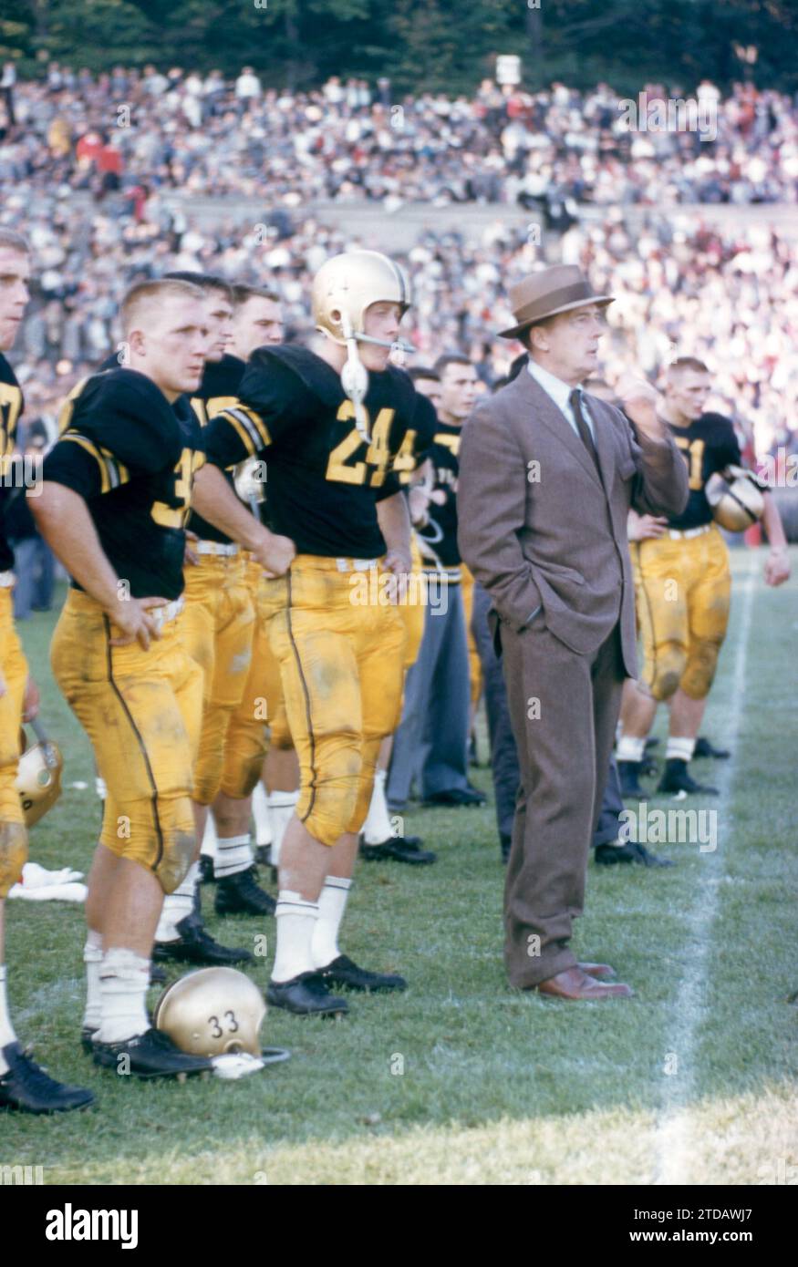 WEST POINT, NY - OCTOBER 4: Harry Walters #33, Pete Dawkins #24 and head coach Earl 'Red' Blaik of the Army Cadets stand on the sidelines during an NCAA game against the Penn State Nittany Lions on October 4, 1958 at Michie Stadium in West Point, New York. The Cadets defeated the Nittany Lions 26-0. (Photo by Hy Peskin) *** Local Caption *** Harry Walters;Pete Dawkins;Earl 'Red' Blaik Stock Photo