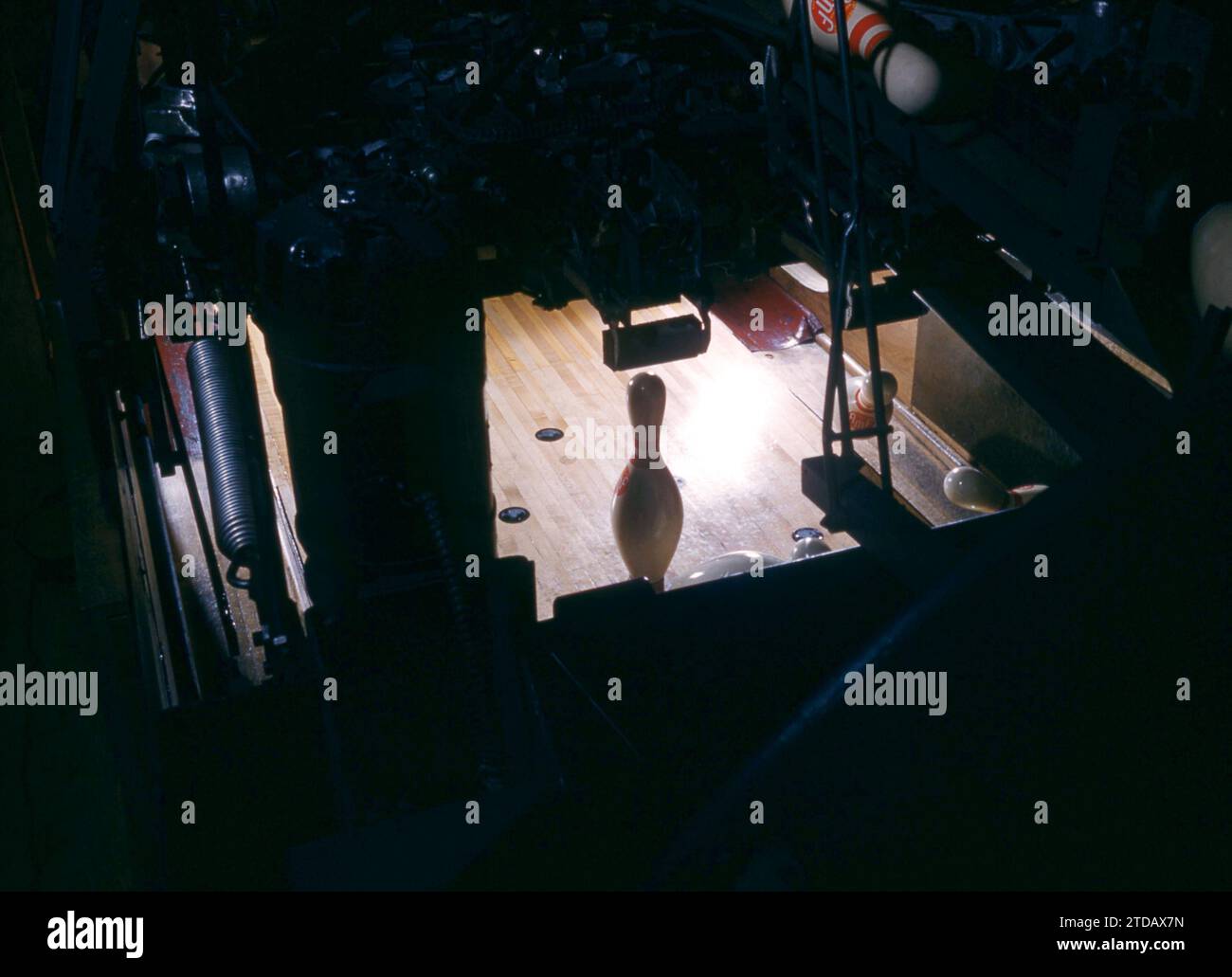 1955:  General view of the 9 pin from the back of the rack as it stands on the spotting deck in a bowling alley circa 1955.  (Photo by Hy Peskin) Stock Photo