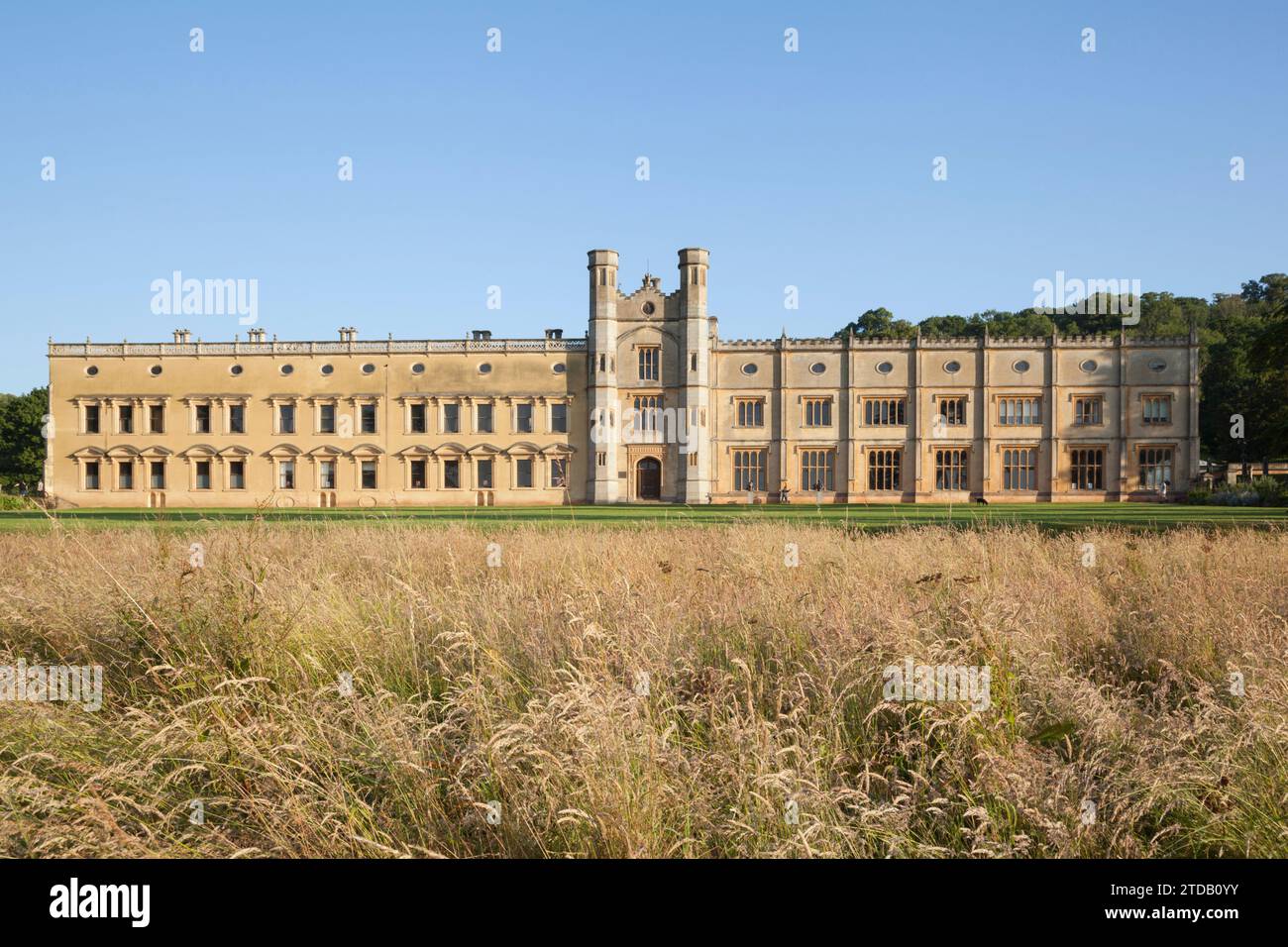 The russet hues of seeding grass below the main lawn compliment the east facade of the house. Ashton Court Estate, Bristol, UK. Stock Photo
