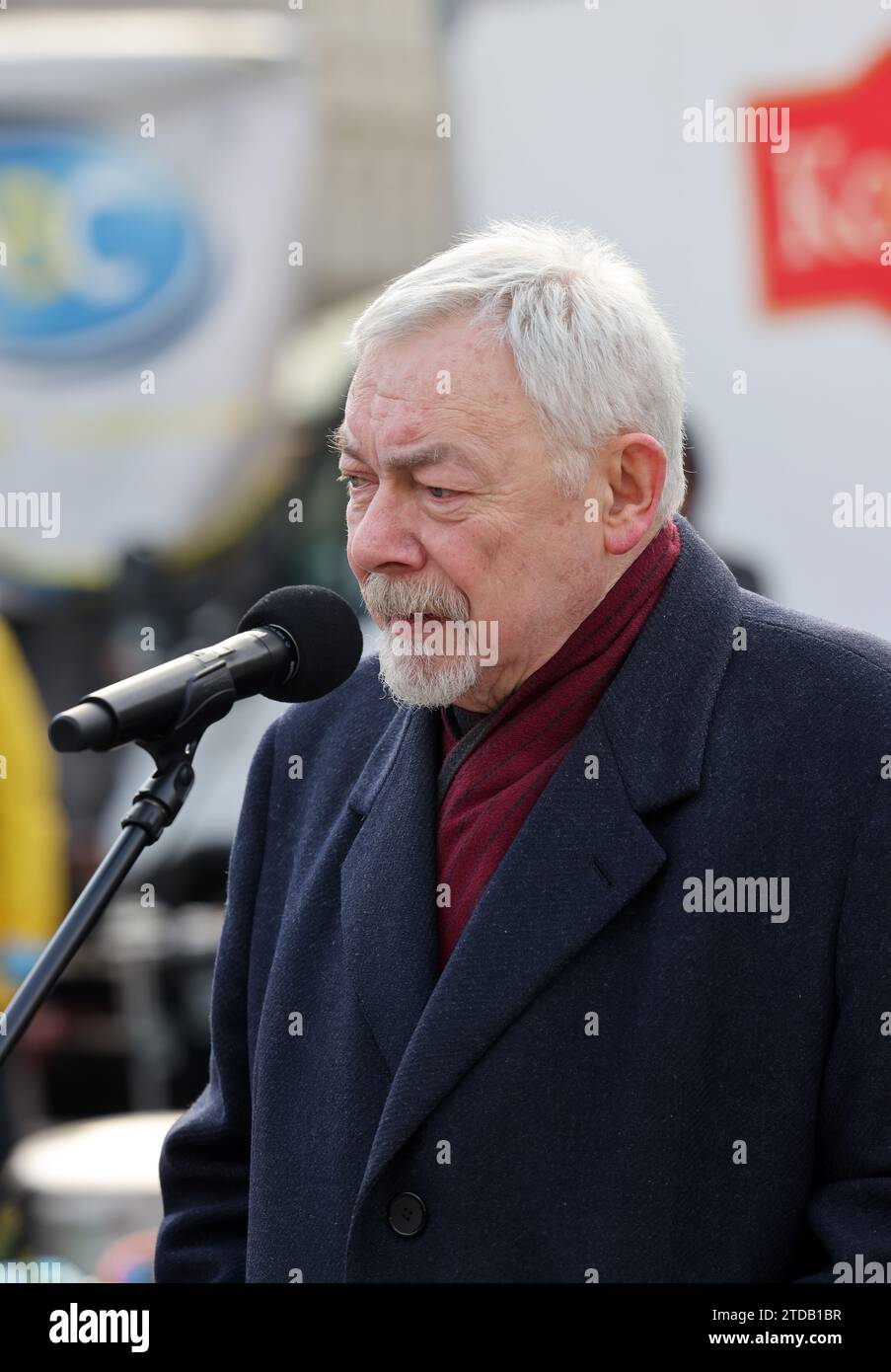 Cracow, Poland - Dec 17, 2023: President of Krakow Jacek Majchrowski participates in the Christmas Eve for the poor and homeless on the Main Square in Cracow. Stock Photo