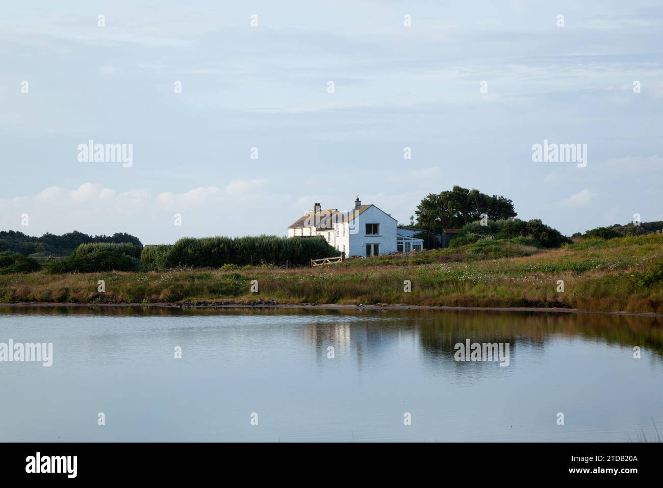 House next to pond. Bryher. Isles of Scilly, Cornwall, UK. Stock Photo