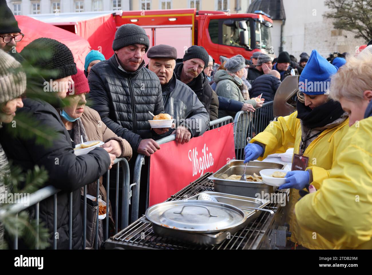 Krakow, Poland - Dec 17, 2023: Christmas Eve for poor and homeless on the Main Square in Cracow. The group Kosciuszko prepares the greatest eve in the open air in Krakow Stock Photo