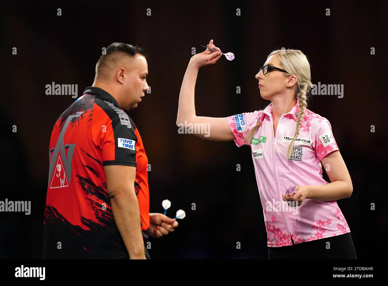 Fallon Sherrock in action against Jermaine Wattimena (left) on day three of the Paddy Power World Darts Championship at Alexandra Palace, London. Picture date: Sunday December 17, 2023. Stock Photo