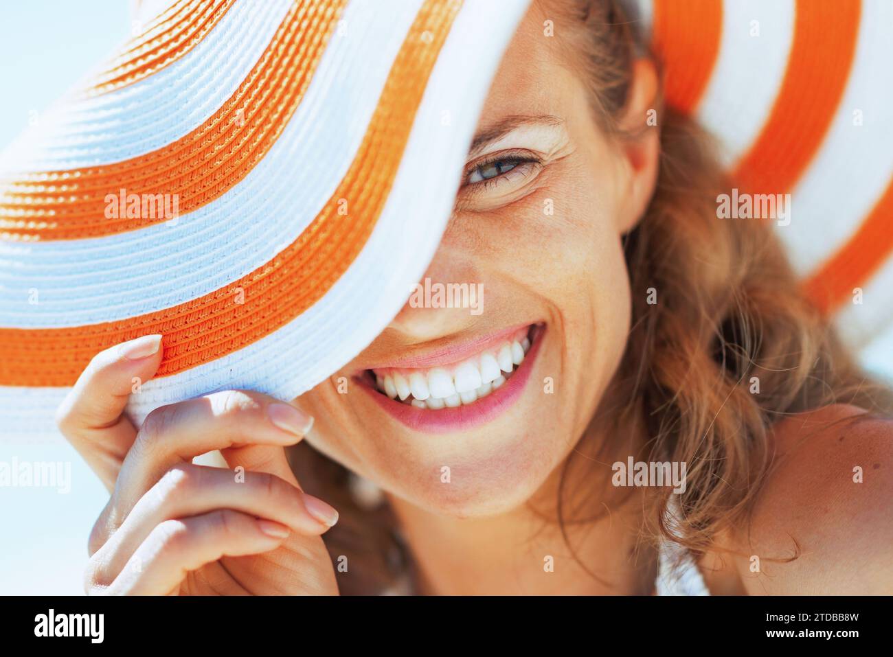 happy young woman in swimsuit and beach hat Stock Photo - Alamy