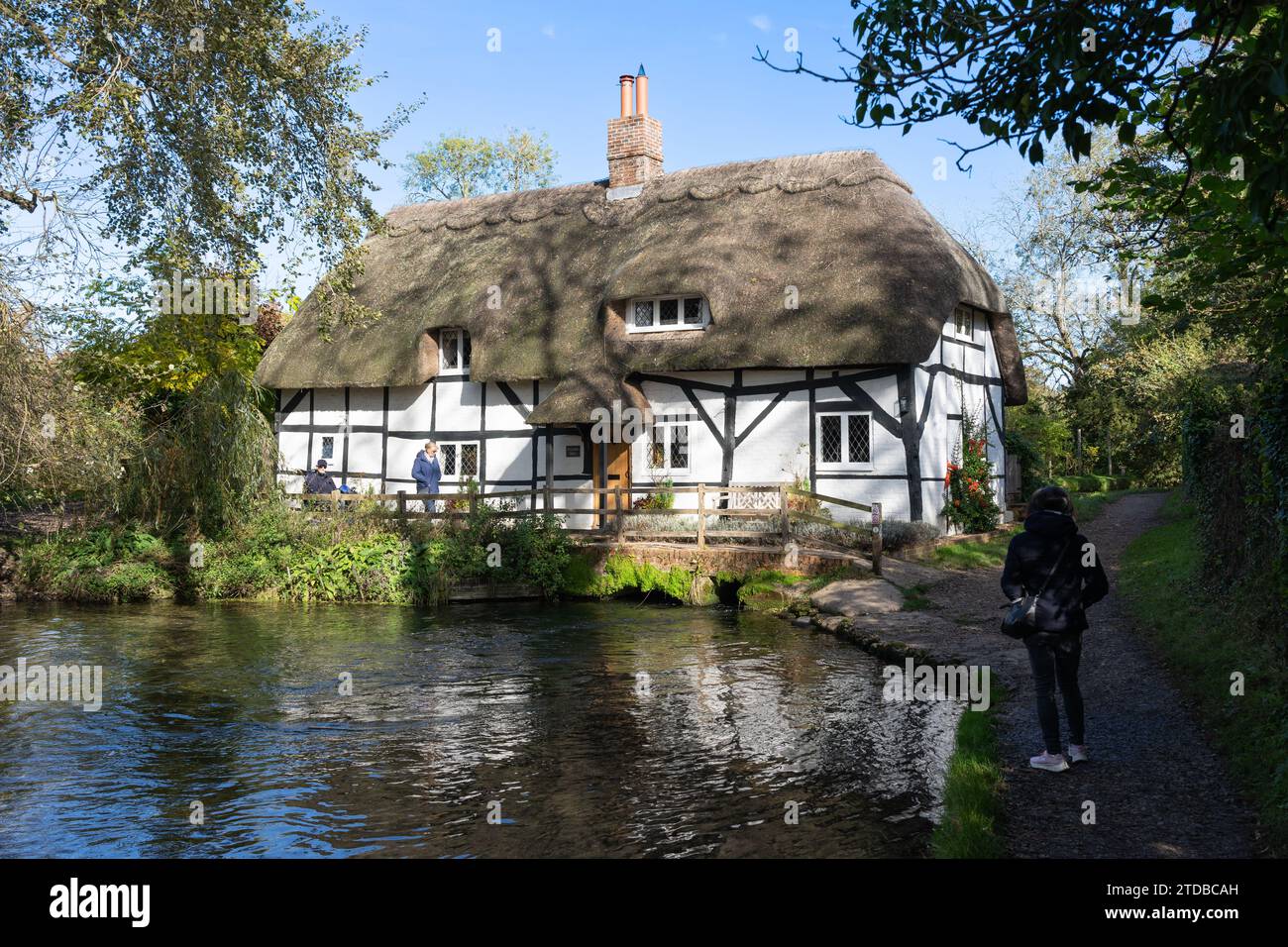 Visitors at the Fulling mill on the river Alre in New Alresford, previously a mill used for the fulling of sheep's wool cloth. Hampshire, UK Stock Photo