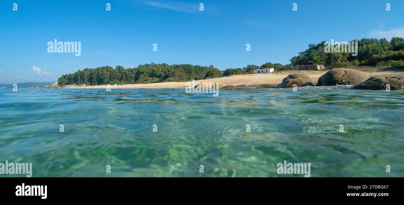 Beach seen from water surface on the Atlantic coast of Spain, natural scene, Galicia, Rias Baixas, Pontevedra province, Praia de Tulla Stock Photo