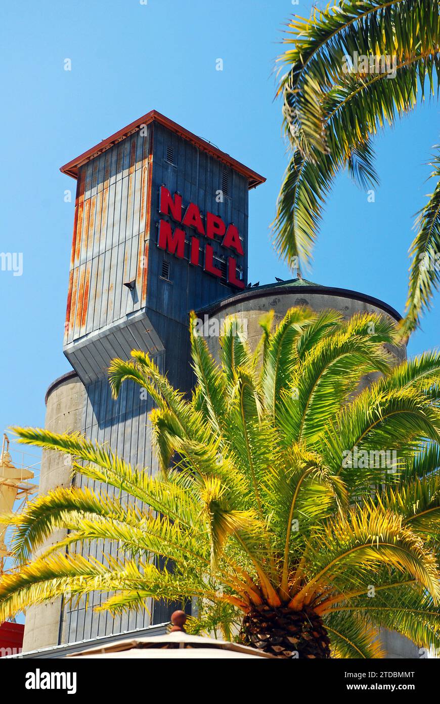 The historic Mill now a restaurant and cafe in Napa, California is framed by palm trees Stock Photo