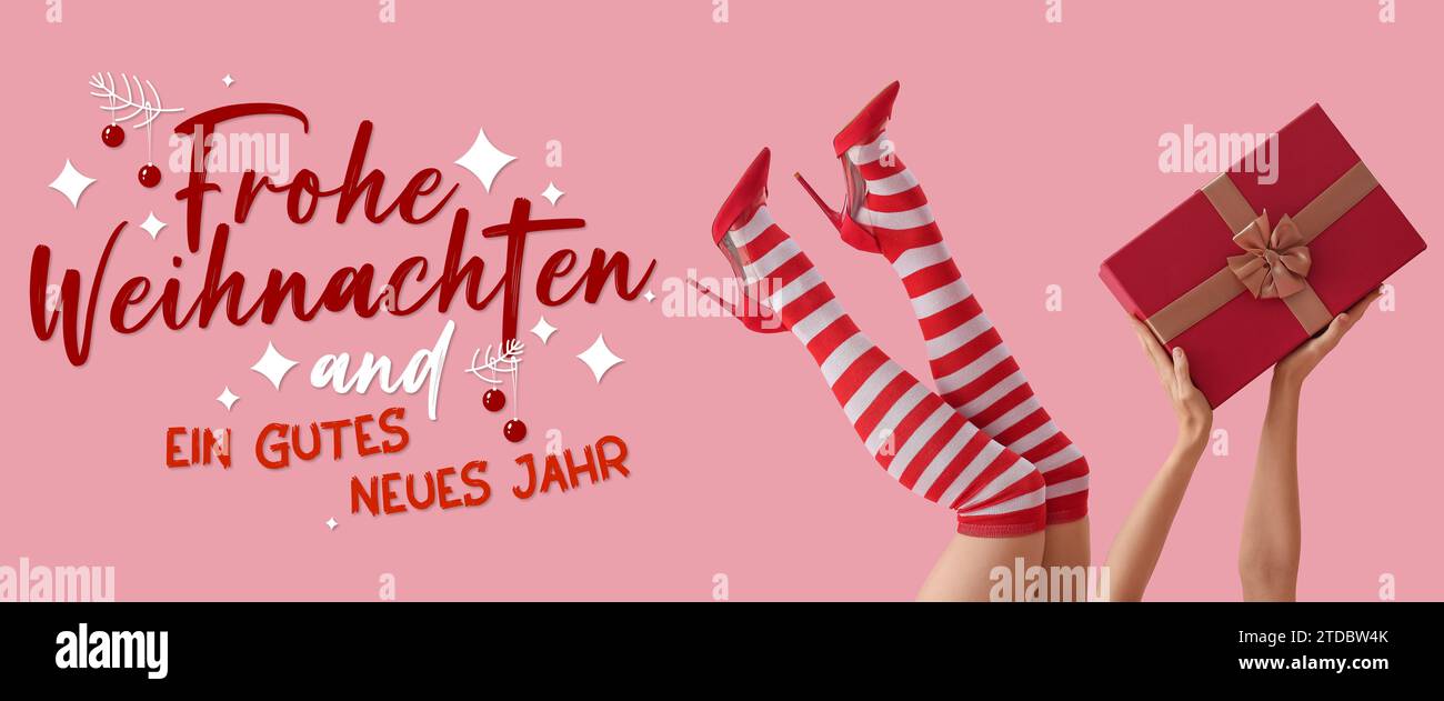 Text FROHE WEIHNACHTEN END GUTES NEUES JAHR (German for Merry Christmas and Happy New Year) and woman in Christmas stockings and with gift on pink bac Stock Photo