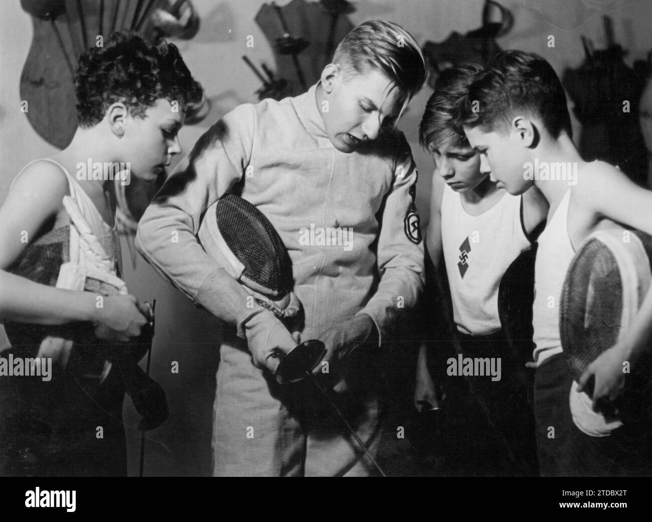 Germany, 1944. An instructor giving explanations to some of his students at a Hitler Youth fencing school. Credit: Album / Archivo ABC Stock Photo