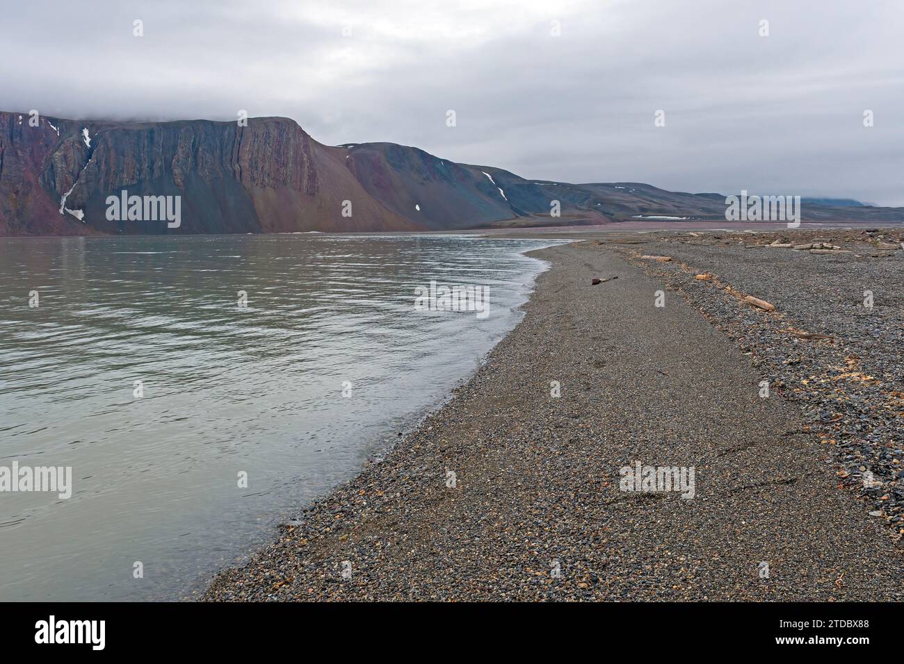 Quiet Gravel Beach on the High Arctic on Lomfjorden in the Svalbard Islands Stock Photo