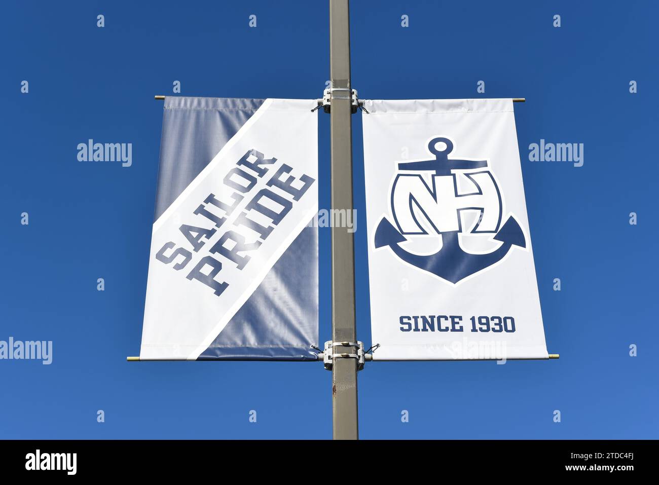 NEWPORT BEACH, CALIFORNIA - 17 DEC 2023: Banners at Newport Harbor High School, With slogan Sailor Pride. Stock Photo