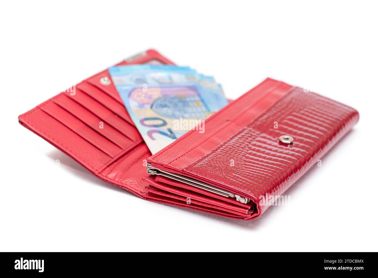 Opened Red Women Purse with 20 Euro Banknotes Inside - Isolated on White Background. A Wallet Full of Money Symbolizing Wealth, Success, Shopping and Social Status - Isolation Stock Photo