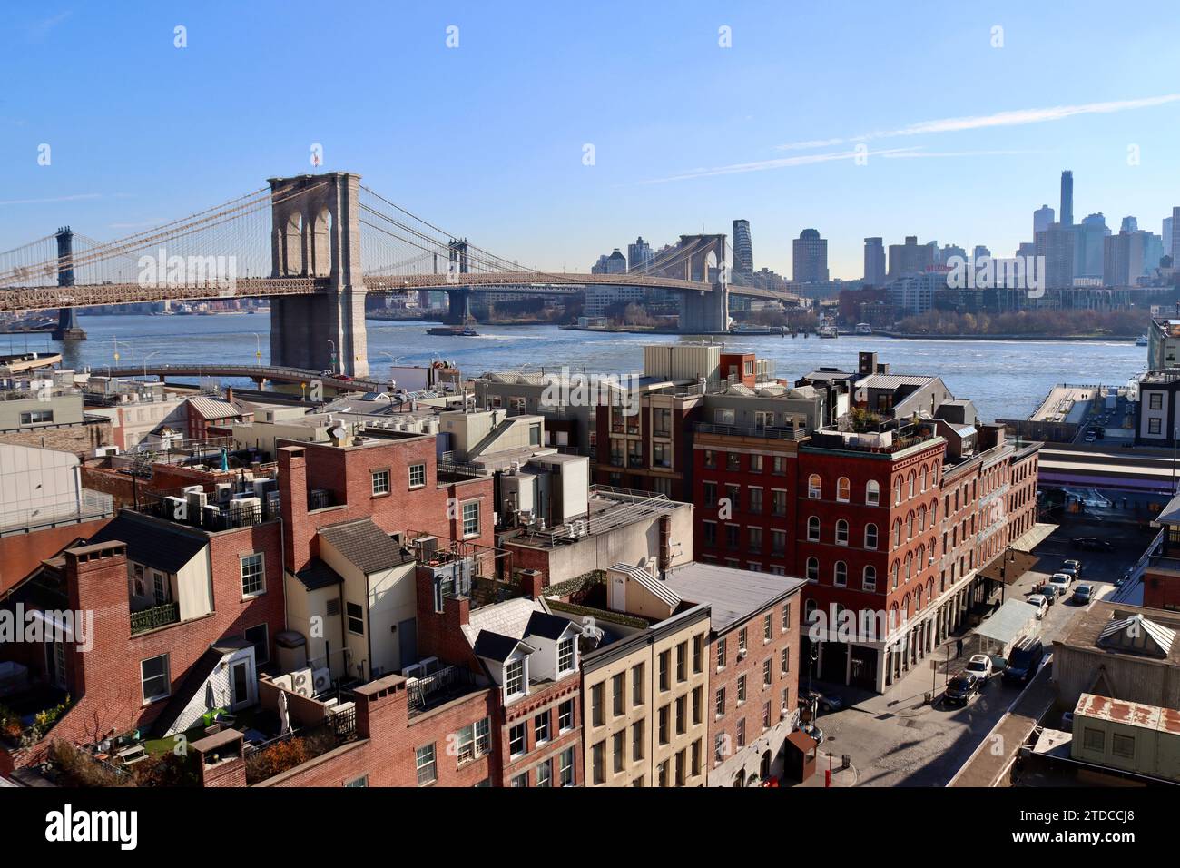 Brooklyn Bridge and Manhattan Bridge seen over the old South Street Seaport district in lower Manhattan, New York Stock Photo