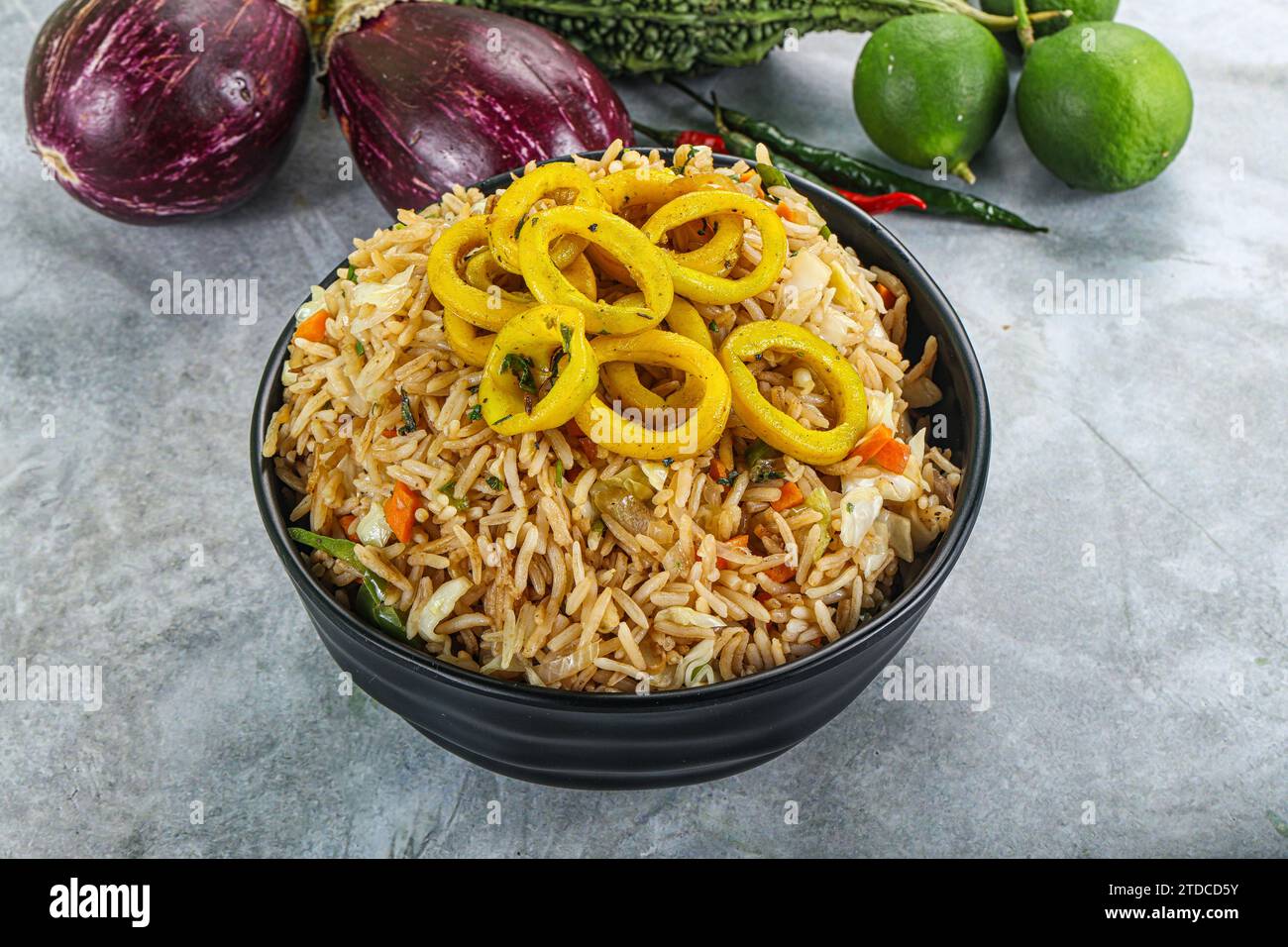 Asian cuisine - Fried rice with squid rings Stock Photo - Alamy