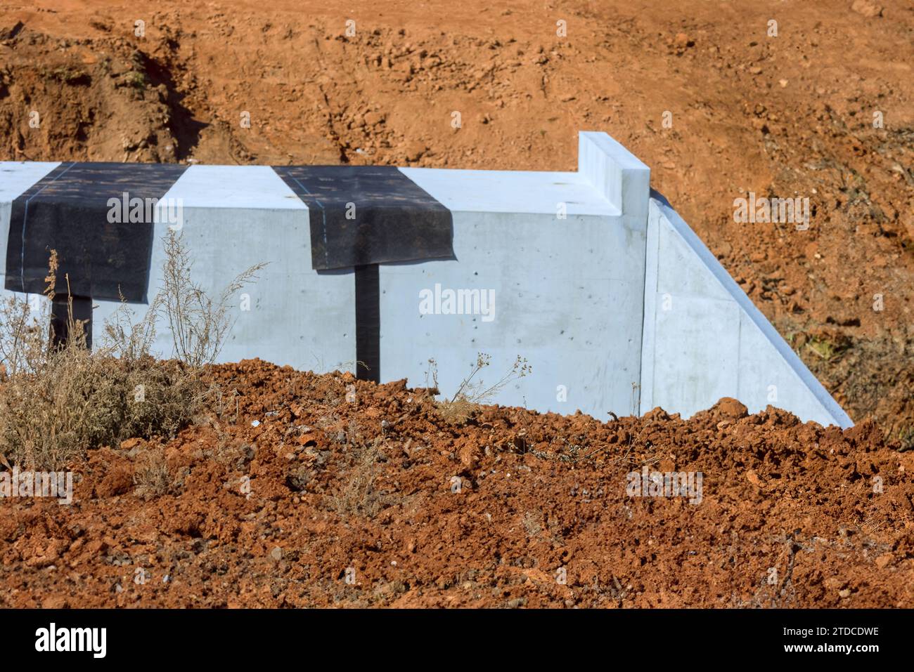 An concrete bridge constructed over stream in countryside with detailed ...