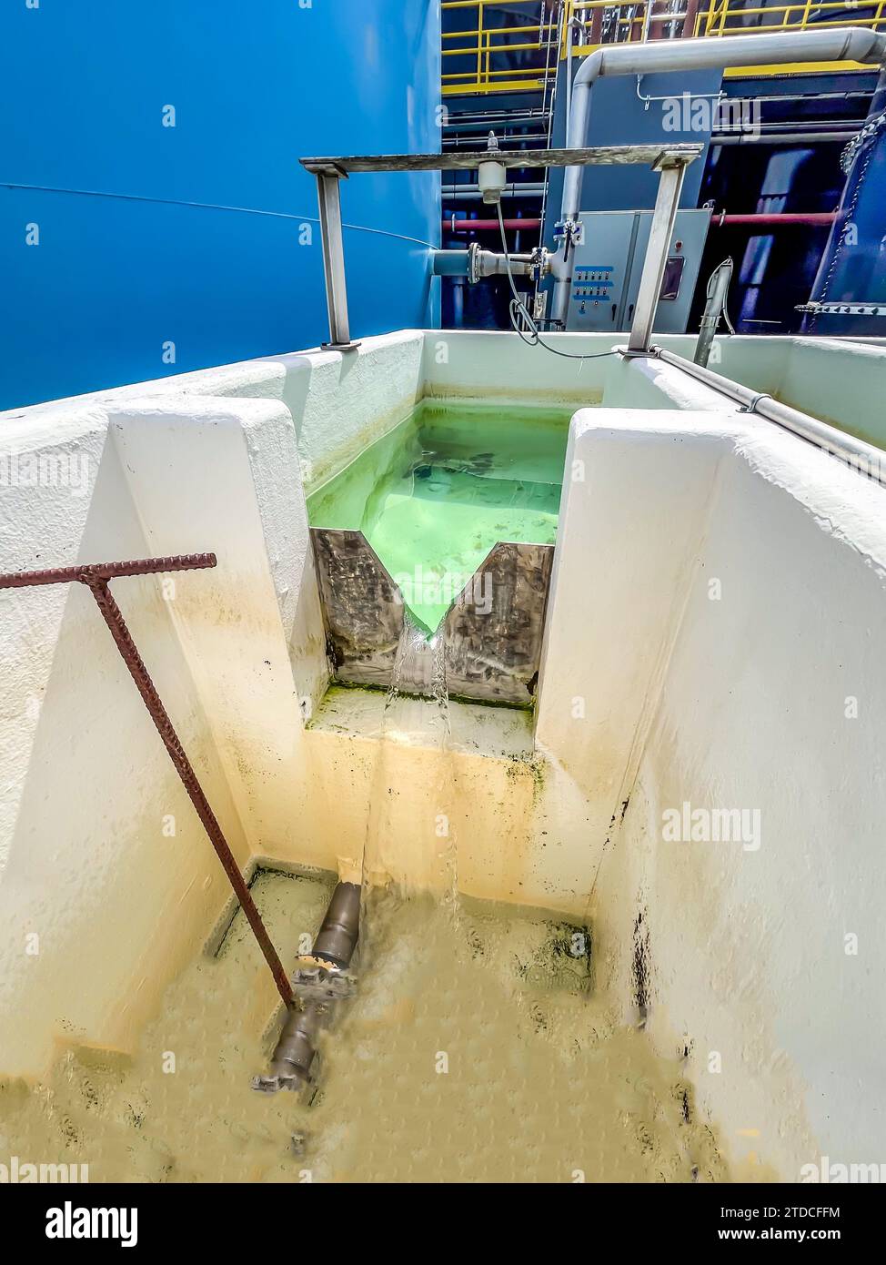 Industrial weir for measure flow of water through a Vnotch Stock Photo