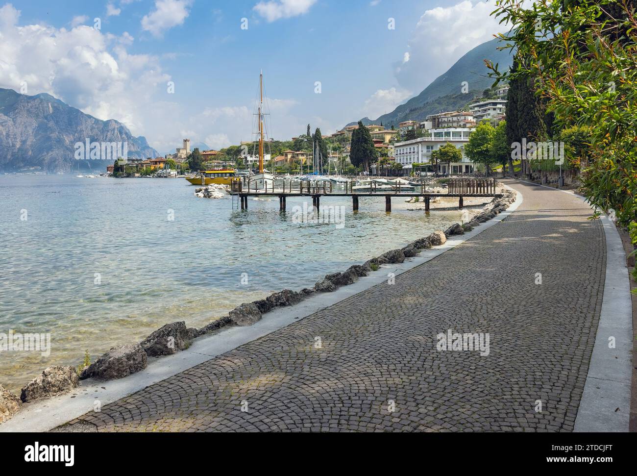 boats and promenade Malcesine on the shores of Lake Garda in Italy Stock Photo
