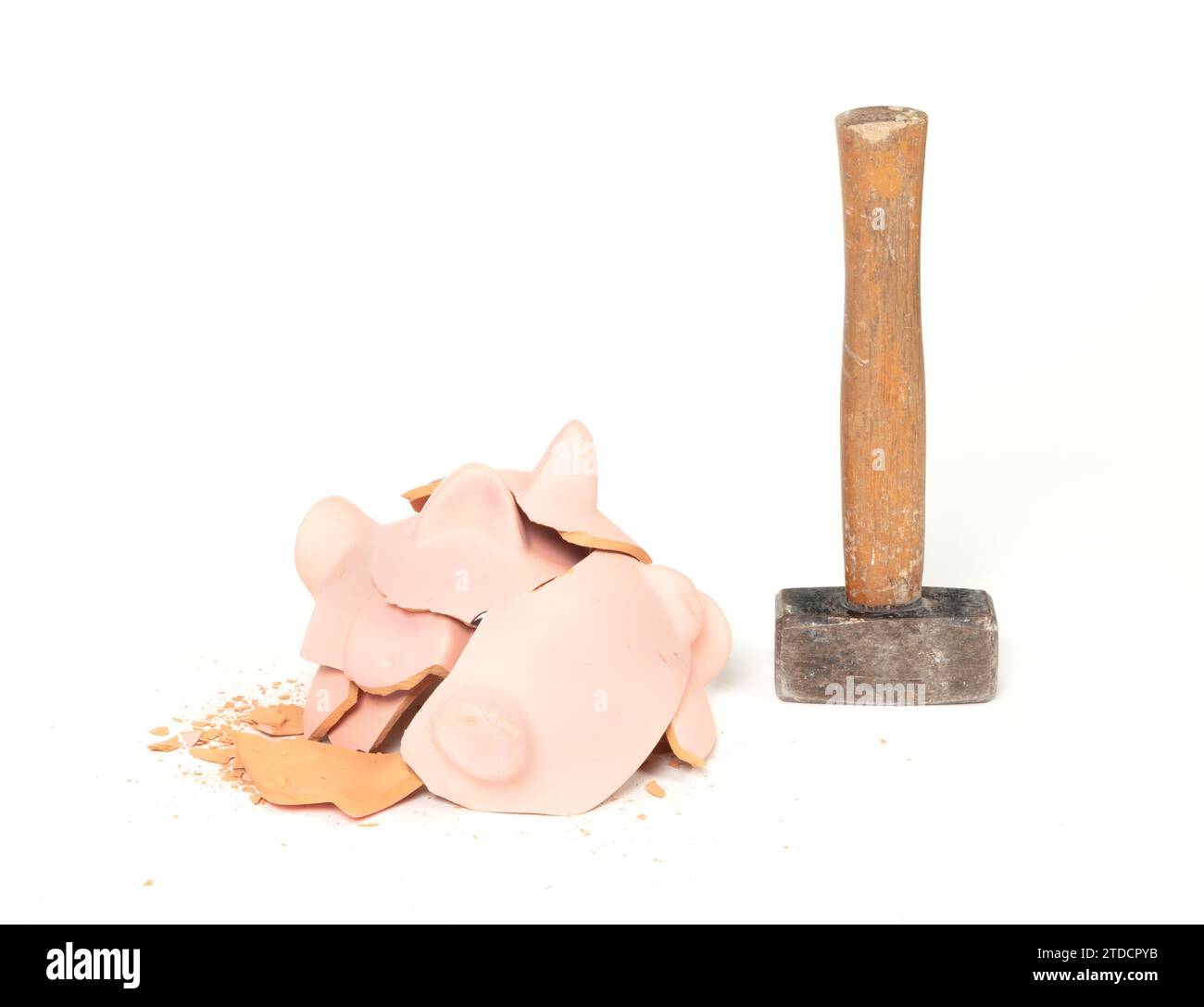 Hammer breaking piggy bank isolated on white Stock Photo - Alamy