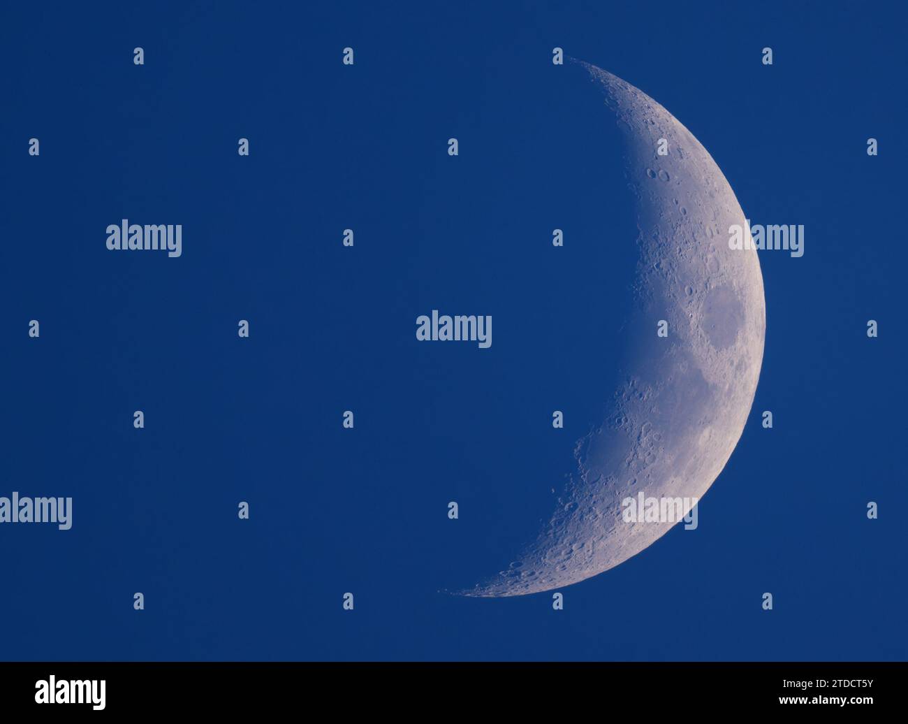17 December 2023, Brandenburg, Sieversdorf The moon is about 25 percent visible and waxing
