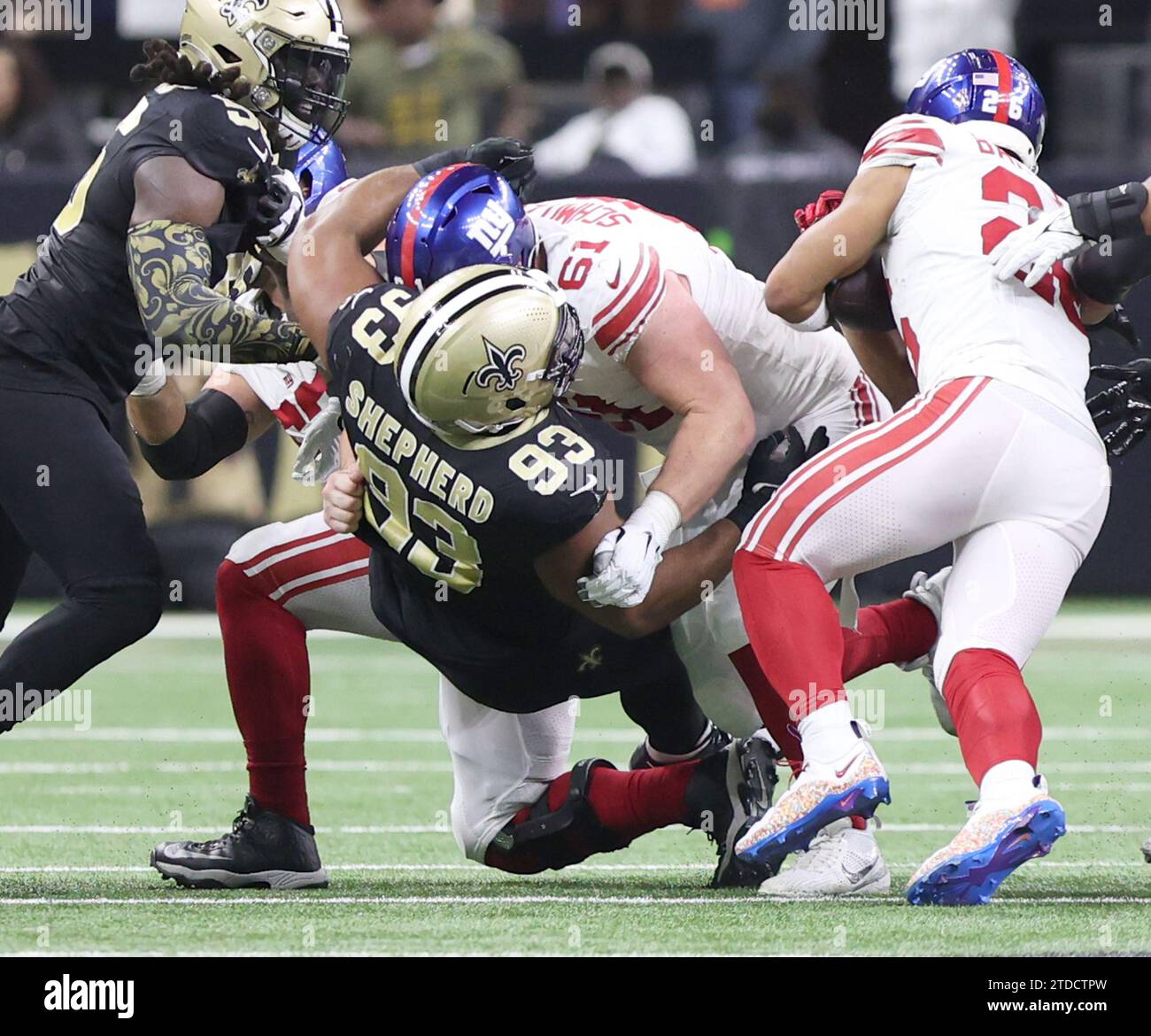 New Orleans, USA. 17th Dec, 2023. New York Giants center John Michael Schmitz Jr. (61) pancake blocks New Orleans Saints defensive tackle Nathan Shepherd (93) during a National Football League game at the Caesars Superdome in New Orleans, Louisiana on Sunday, December 17, 2023. (Photo by Peter G. Forest/Sipa USA) Credit: Sipa USA/Alamy Live News Stock Photo