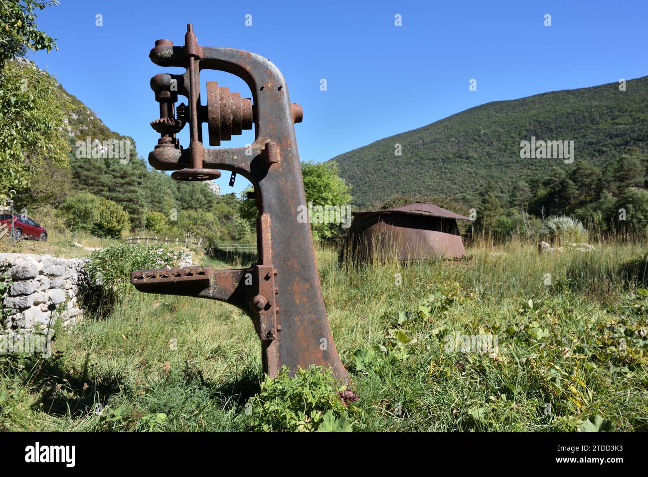 Vintage or Old Wood Clamp for holding logs or tree trunks & Rusty Cauldron in Derelict & Abandoned Sawmill at La Martre Var Provence France Stock Photo