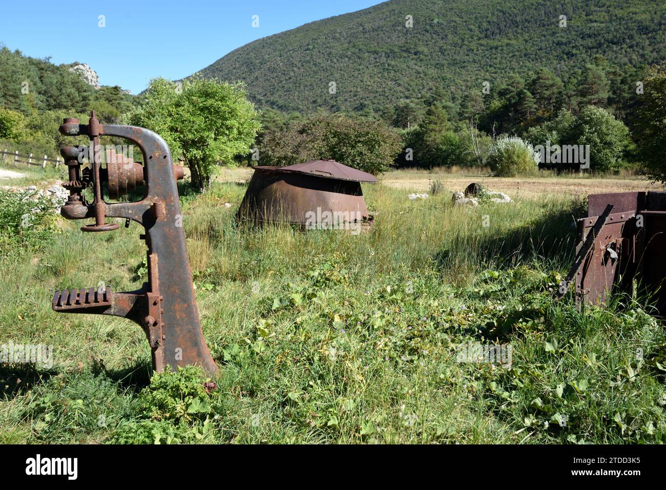 Vintage or Old Wood Clamp for holding logs or tree trunks & Rusty Cauldron in Derelict & Abandoned Sawmill at La Martre Var Provence France Stock Photo