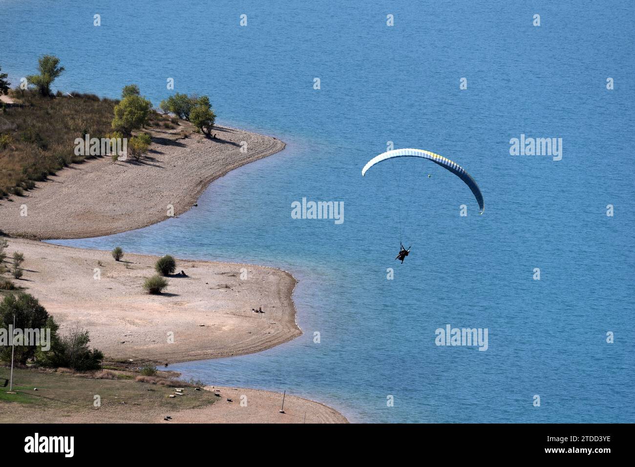 Hang Gliding or Hang Glider Flying over Sainte Croix Lake or Lake of Sainte-Croix Provence France Stock Photo