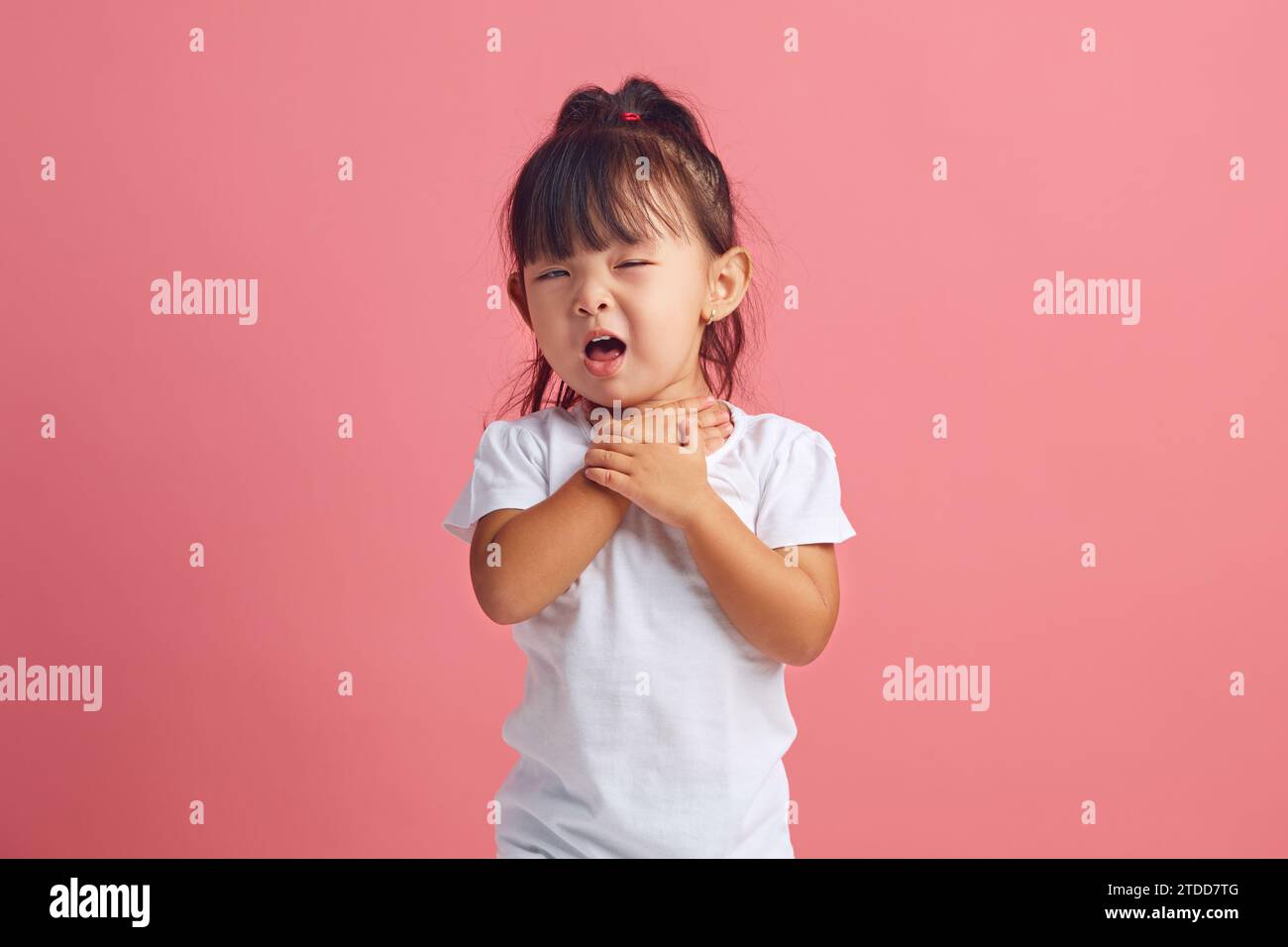 Child health problem and sore throat. Frustrated little girl keeping