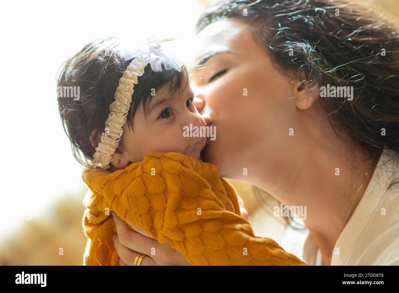 Mother holding her newborn baby girl Stock Photo