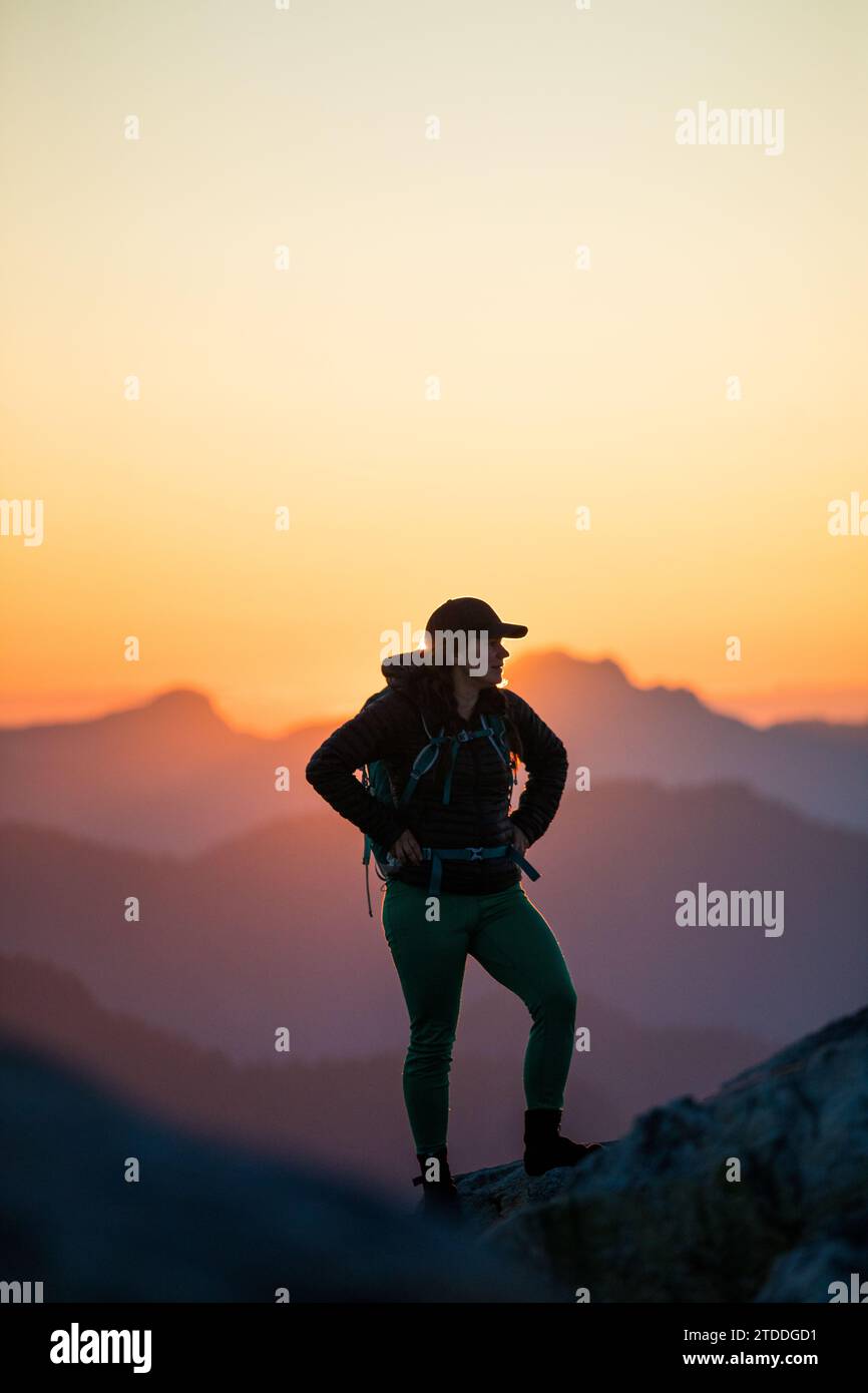 Portrait of strong determined active woman on a mountain. Stock Photo