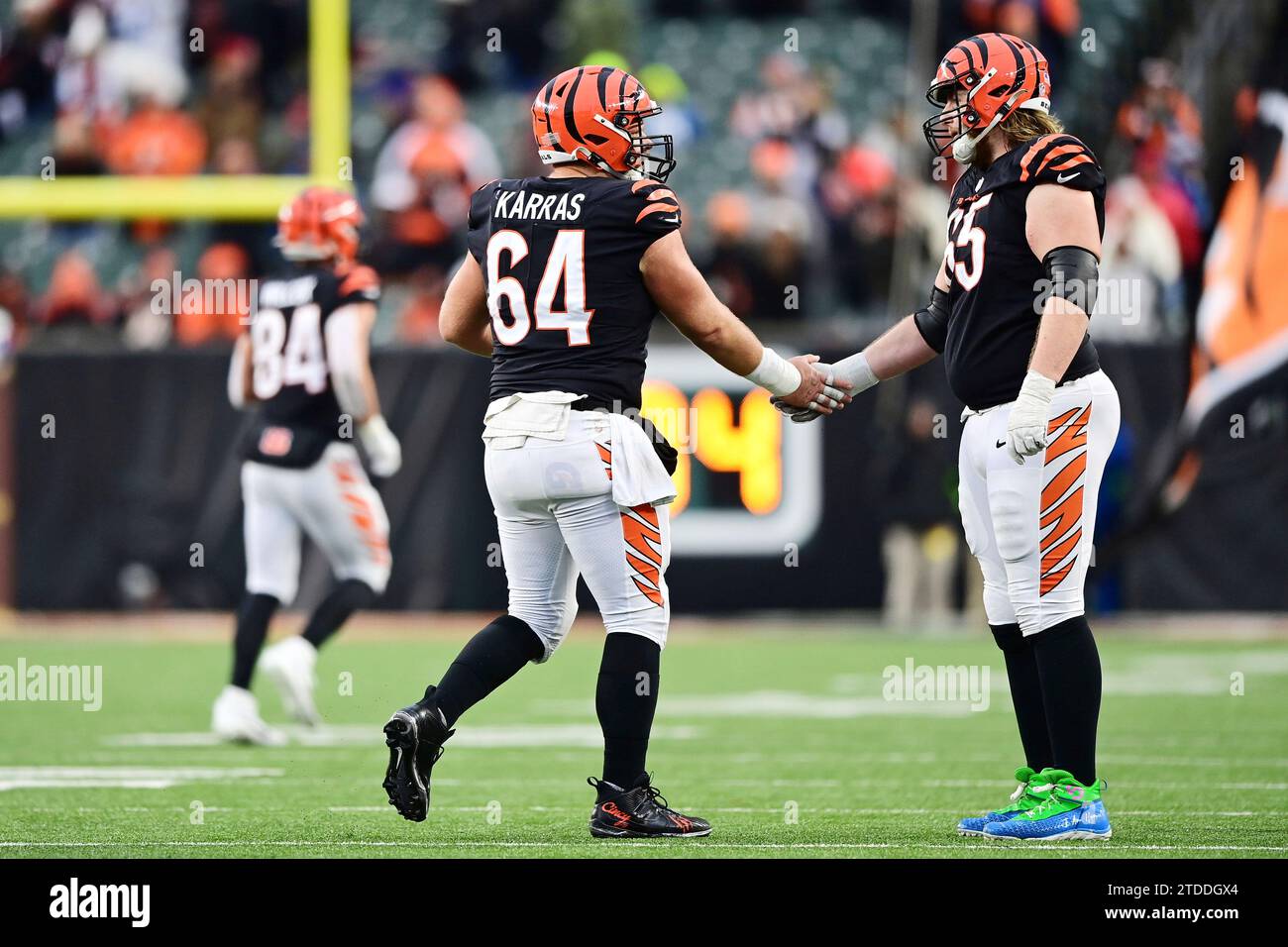 Cincinnati Bengals center Ted Karras (64) high fives guard Alex Cappa (65) during an NFL